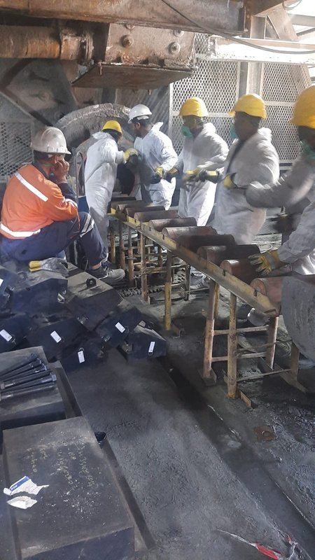 Emaar Liwa crew in protective suits at Mawarid Mining